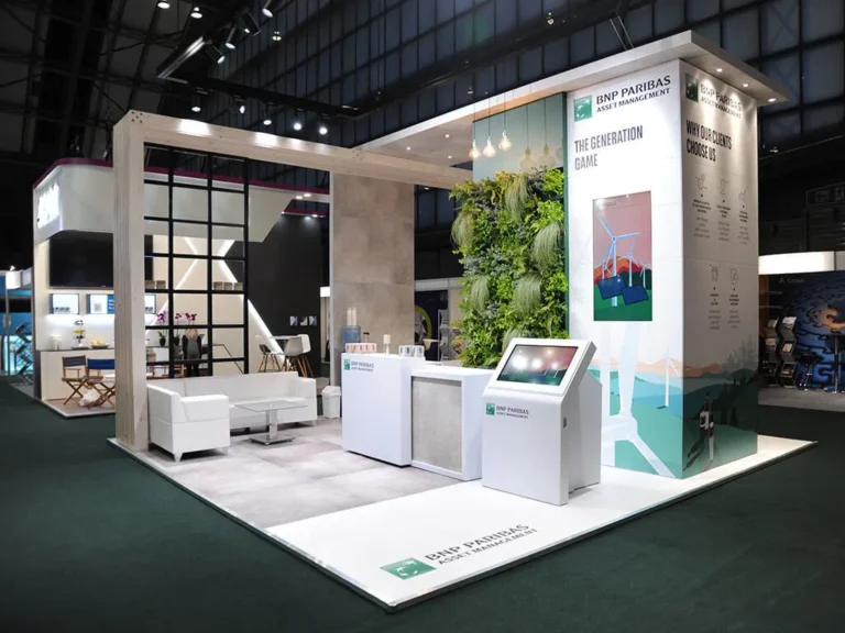 A custom modular exhibition stand for BNP Paribas at the PLSA event, featuring green, white branding, with wooden feature panelling.